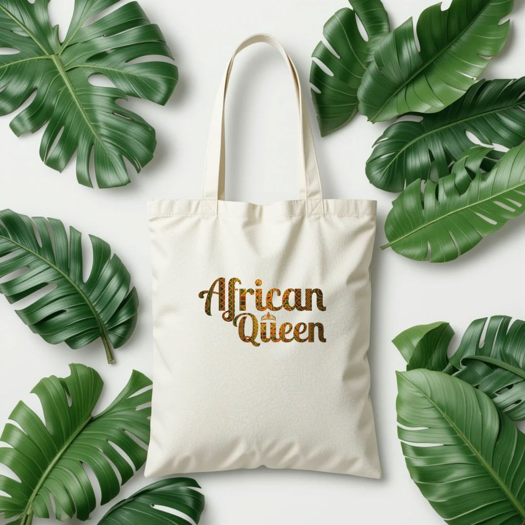 Tote bag with 'African Queen' text surrounded by green leaves on a white background